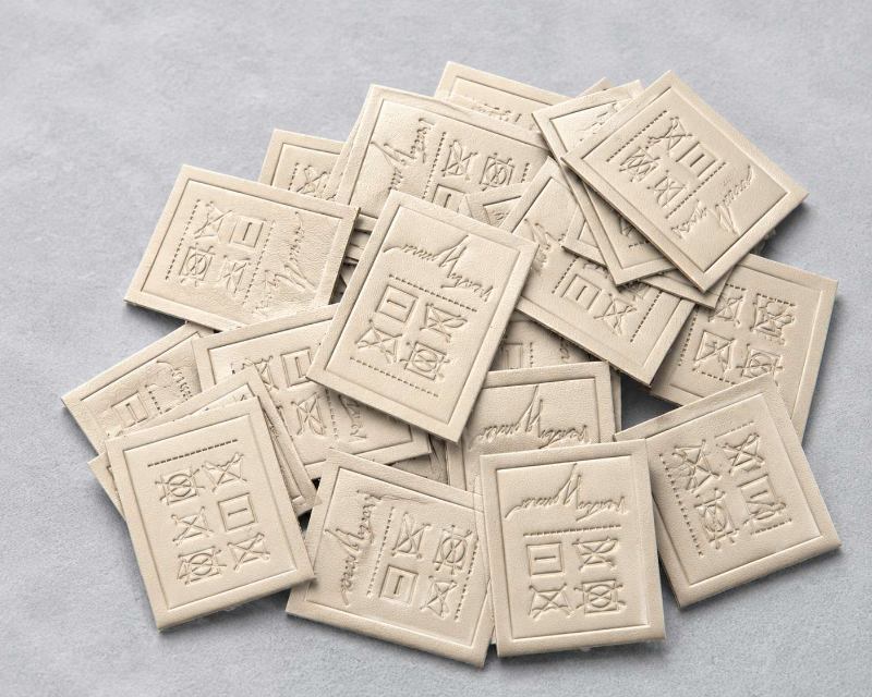 Blind Debossed Cream Leather Clothing Labels