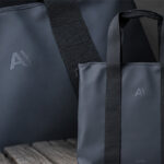 850 Rains bags embossed with AI branding by Krintech Ltd for a high-volume corporate gifting project