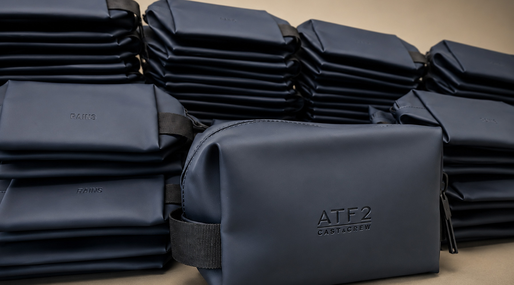 550 Rains wash bags embossed with ATF 2 Cast & Crew branding by Krintech Ltd for film and TV crew gifts